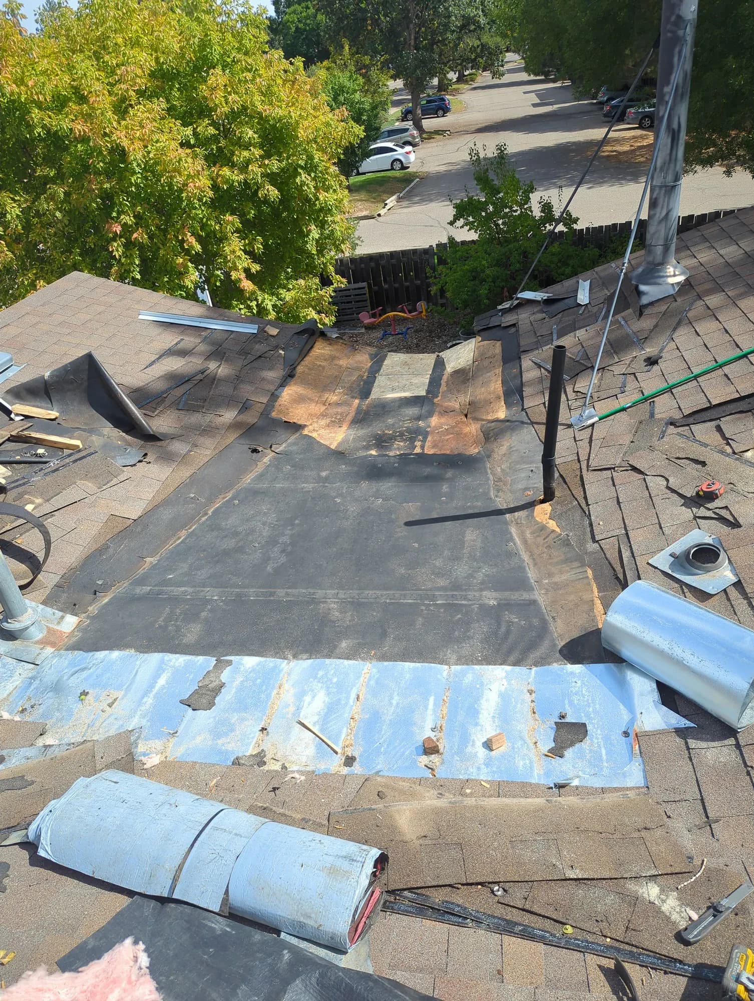 Before: Low-slope valley in Fort Collins, rotted wood replaced and re-roofed