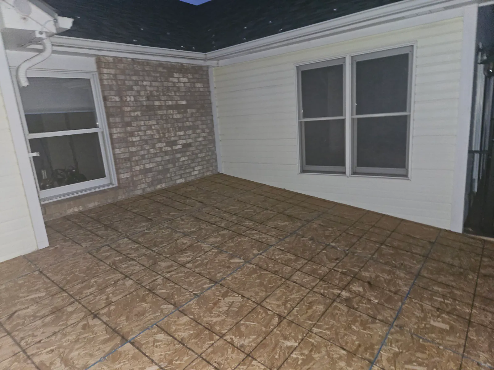 Before: New decking and shingles on a covered patio